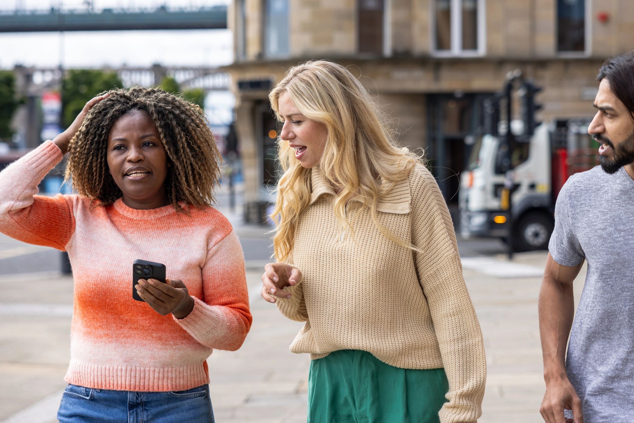 Travelers planning a trip together in a city